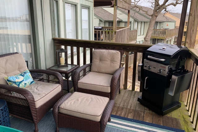 seating area with grill on deck